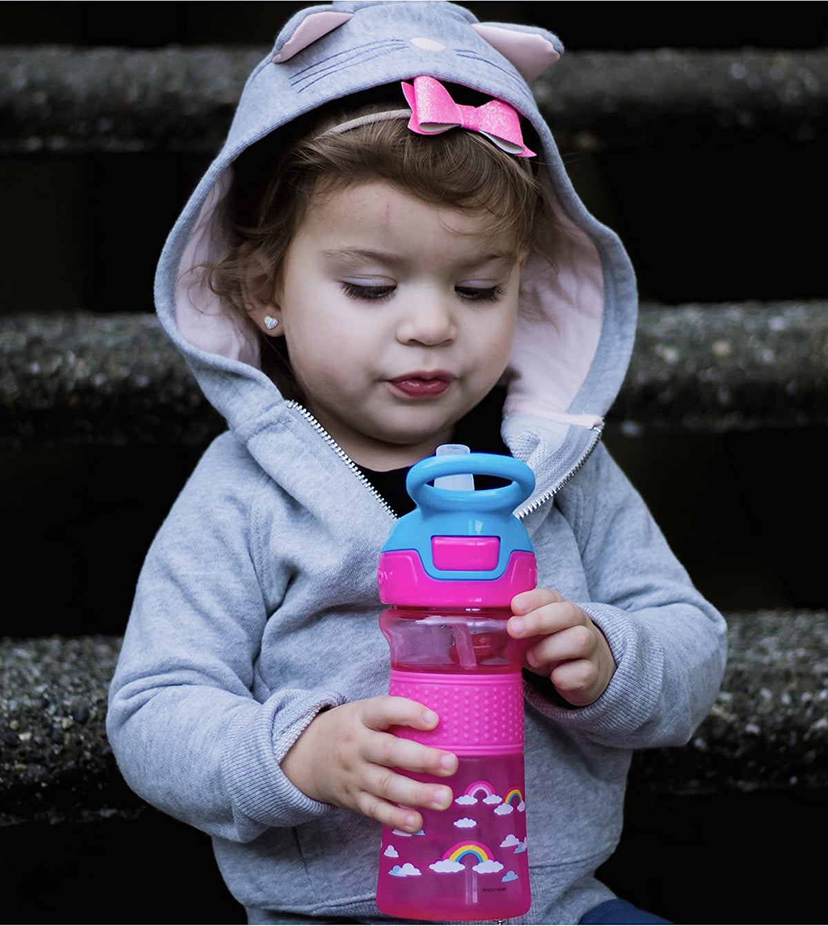 NUBY Thirsty Kids Push Button Flip-it Soft Spout on The Go Water Bottle with Easy Grip Band, Pink Rainbow, 12oz